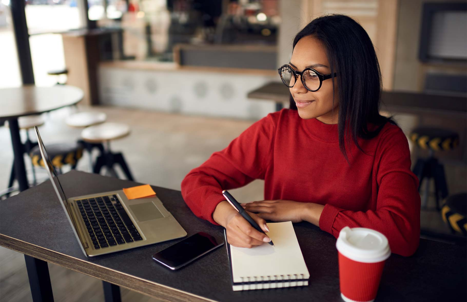 lady writing on desk