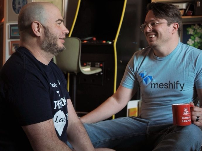 (Left) Andrew's husband and (right) Andrew sharing a laugh.