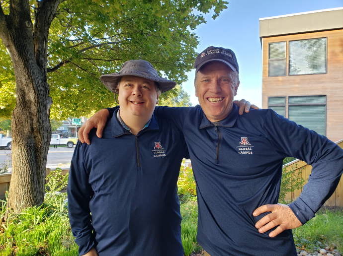 Foster and Blizard smiling in UAGC merch
