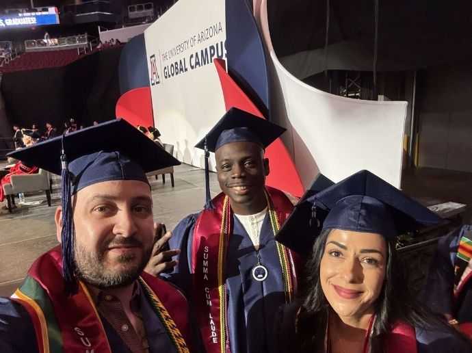 three people dressed in graduation regalia for University of Arizona Global Campus' commencement ceremony.