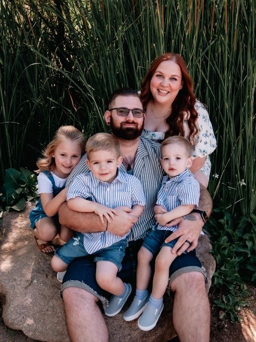 Holli Stapleton posing for a family photo