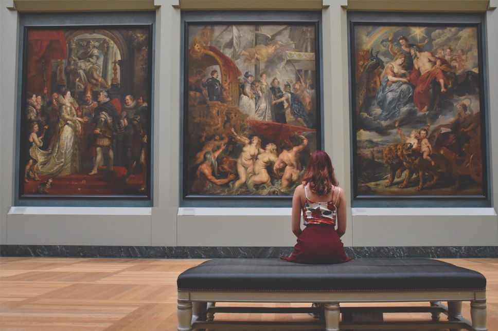 woman sitting in art gallery