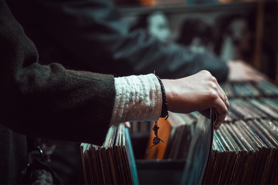 person looking through music records