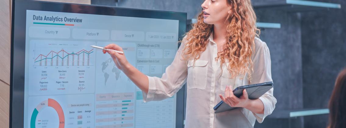 A woman leading an analytics presentation (Getty image)