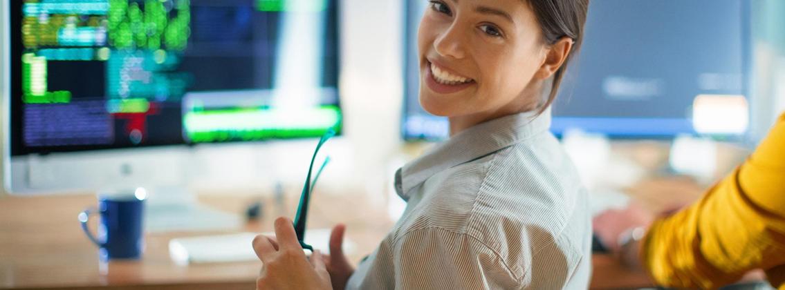 woman smiling at computer