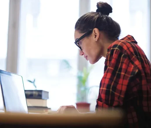 Woman writing the benefits of a liberal arts degree