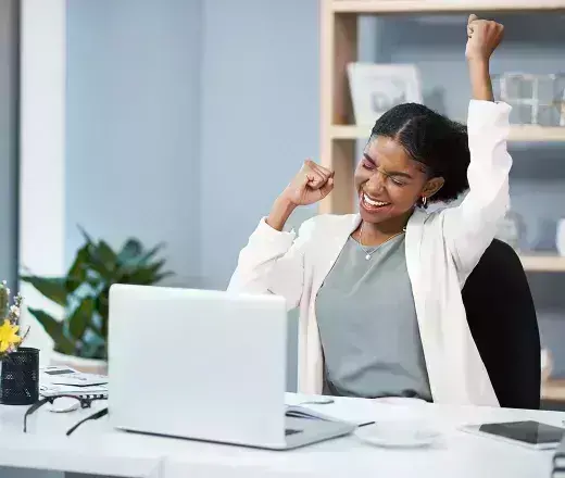 lady hooray gesture in front of laptop