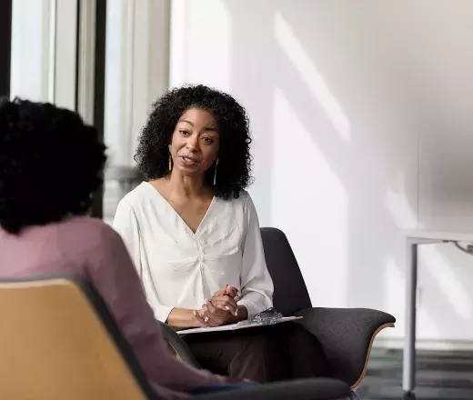 Psychologist talking to client