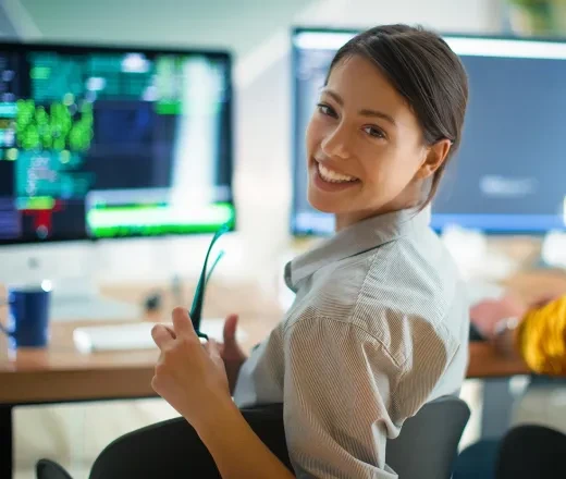 woman smiling at computer