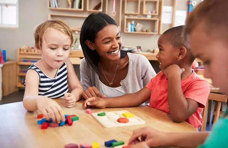 a young professional working with kids