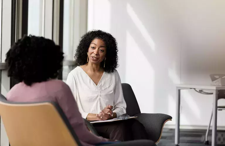 Psychologist talking to client