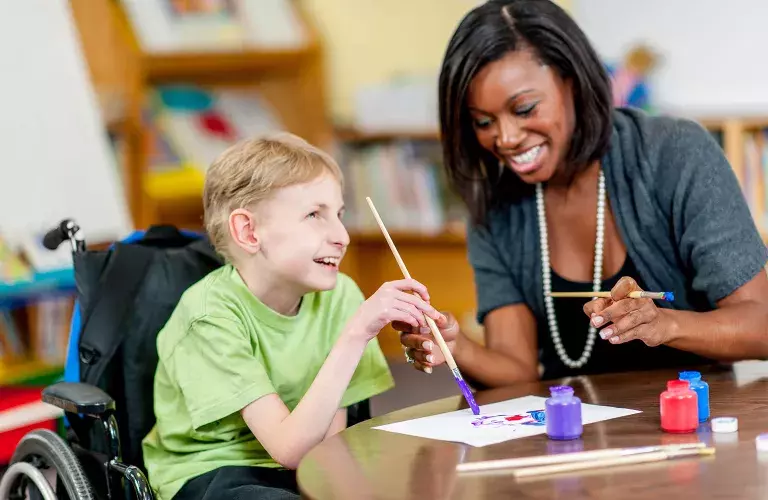 Lady working with special child