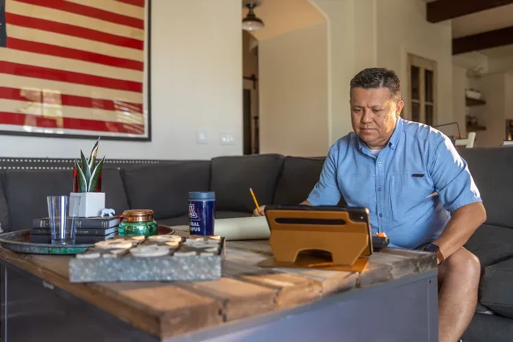 Returning student reviewing his company tuition benefits