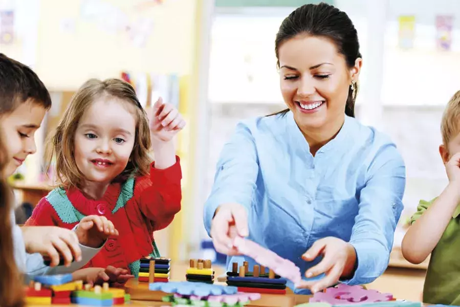 teacher with her young students