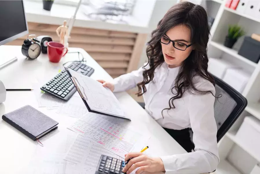 Lady using calculator