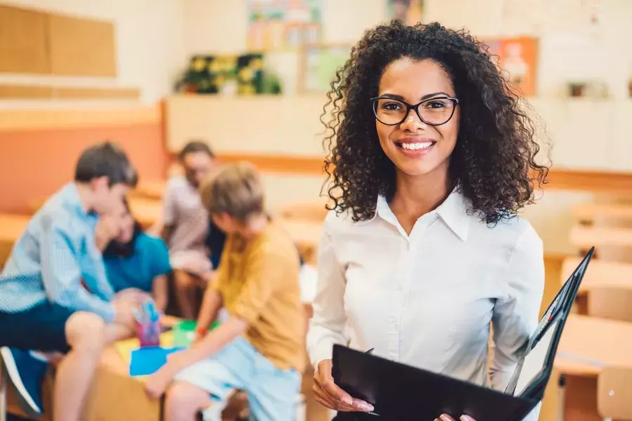 Teacher in class smiling