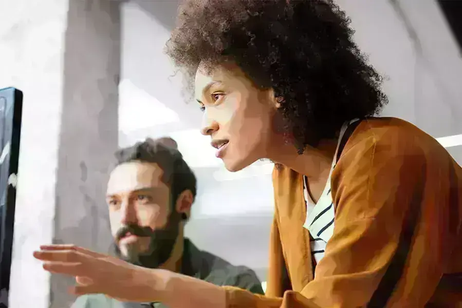 Lady and guy discussing over computer