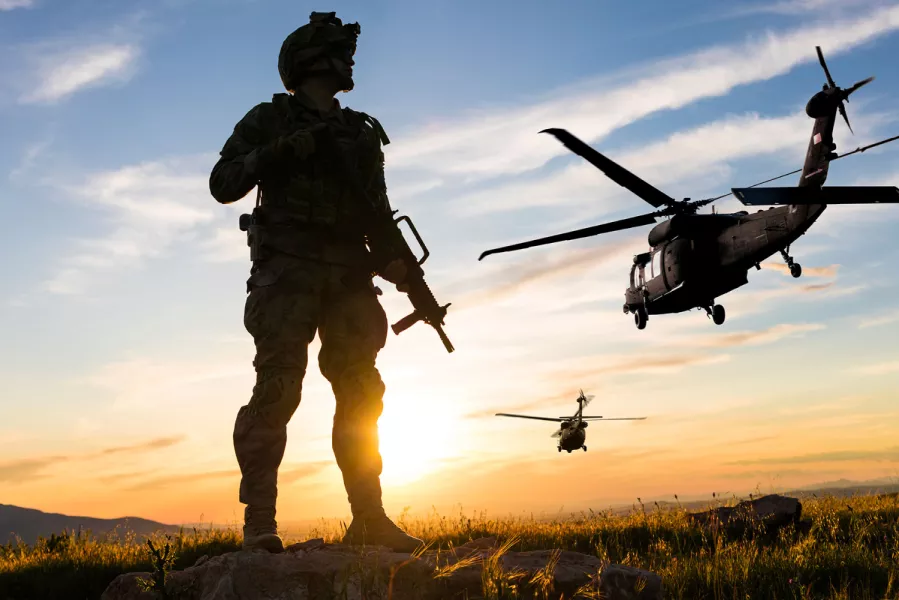Soldier and helicopters