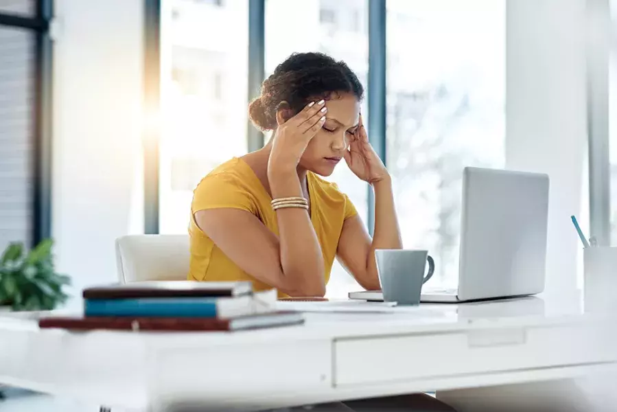 stressed woman in front of computer