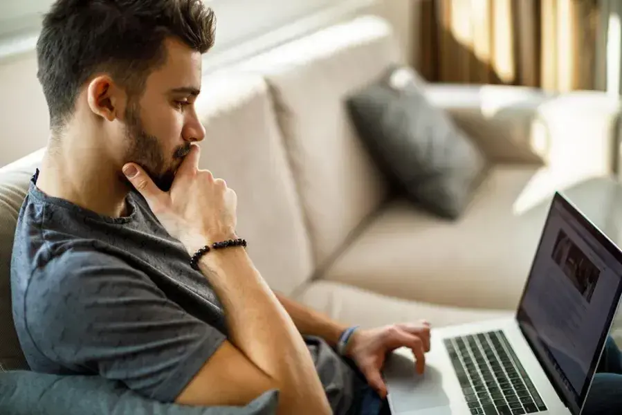 a student focused on his computer