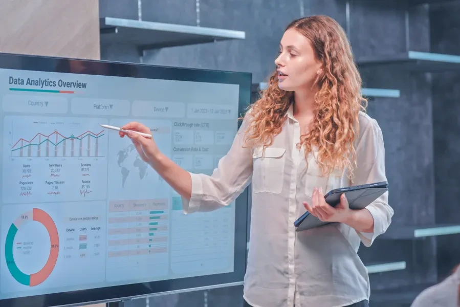 A woman leading an analytics presentation (Getty image)