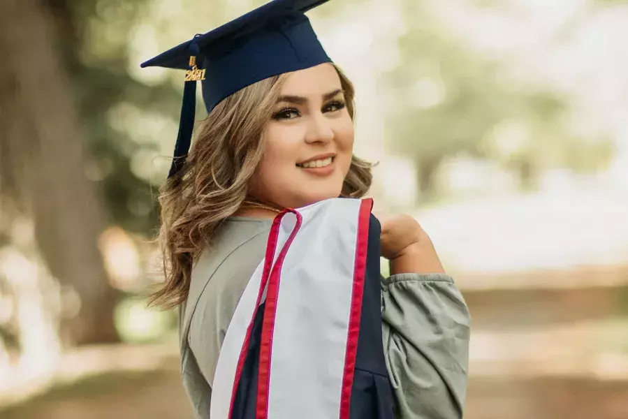 UAGC graduate woman in robes