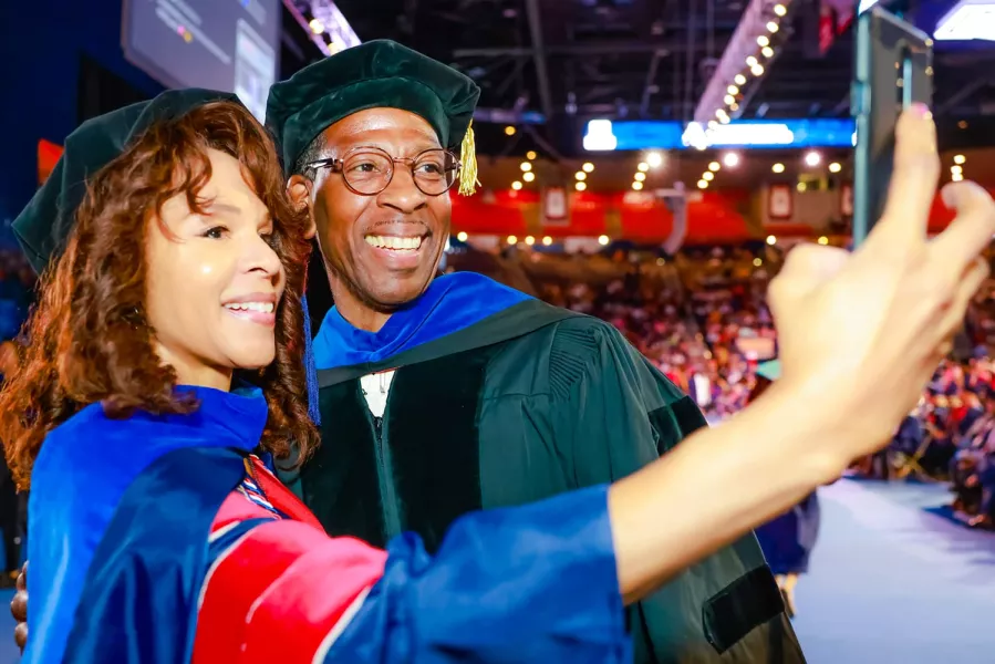 Graduates taking selfie 