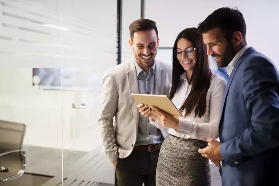 People looking at tablet together