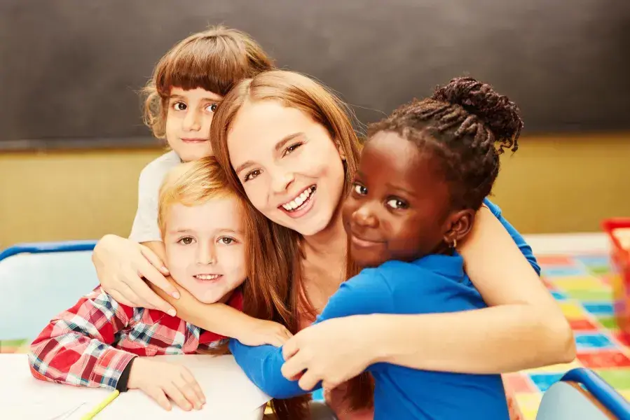 Kids hugging adult