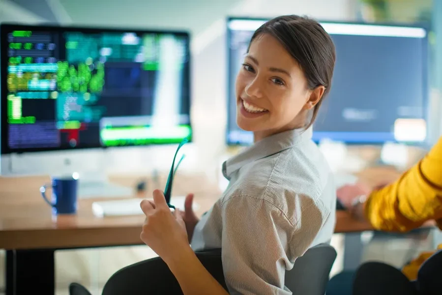 woman smiling at computer