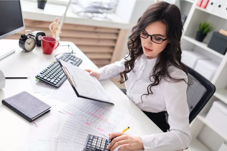 Lady using calculator