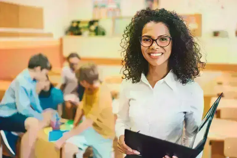 Teacher in class smiling
