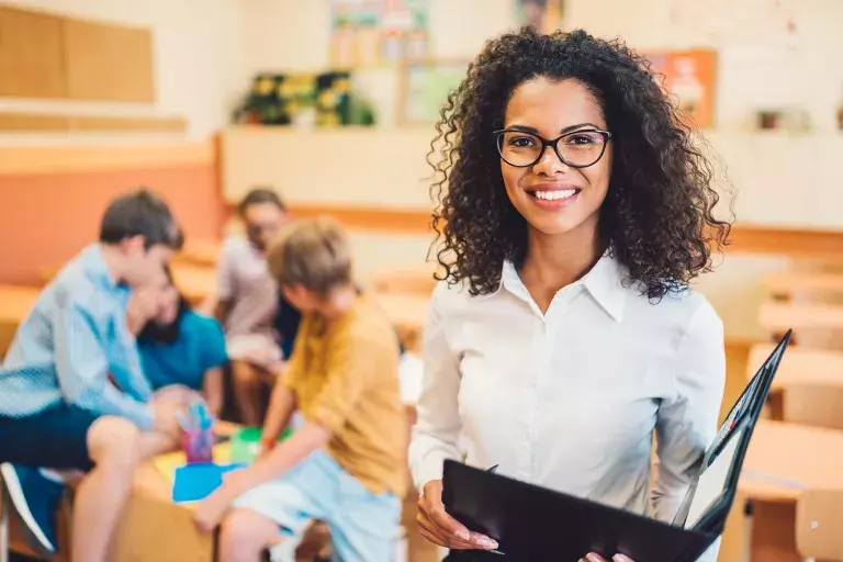 Lady smiling in front of class