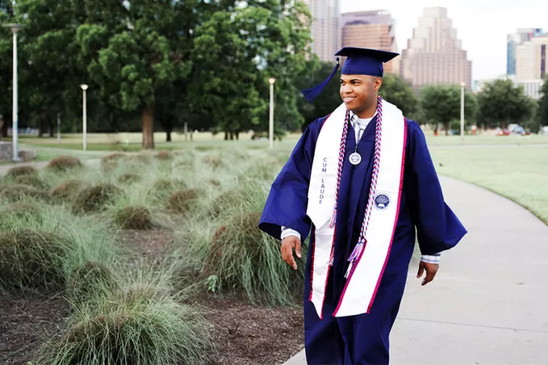 Man after graduation walking