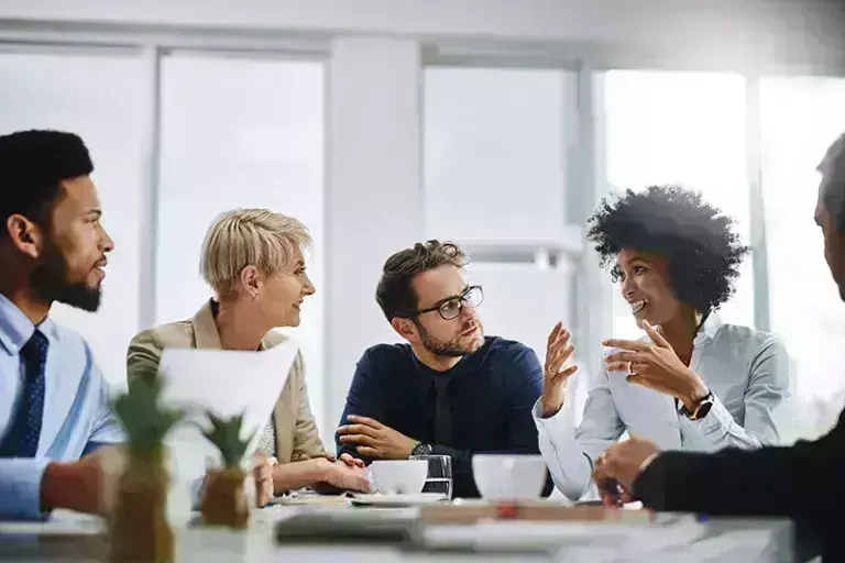 people having a conversation in meeting