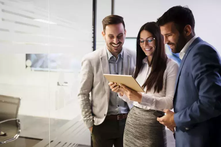 People looking at tablet together