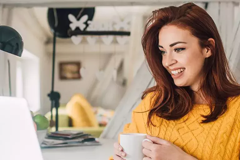 woman looking at her laptop