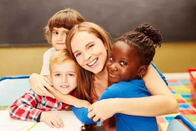 Kids hugging adult